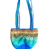 Paris designed Sirena crochet bag with two handles, shown on a neutral background, full front view, rounded shape, turquoise and yellow gradient
Full product view