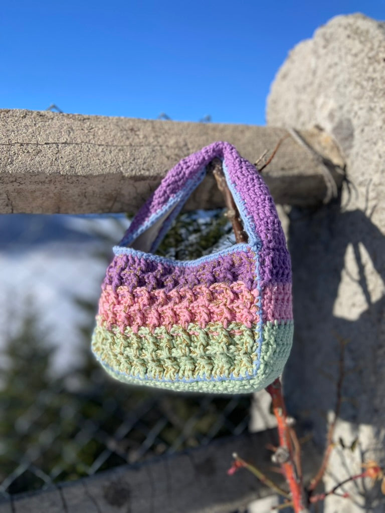 Close-up of the Anabaum Boxy bag's intricate waffle-stitch crochet pattern in premium pastel-tonal cord