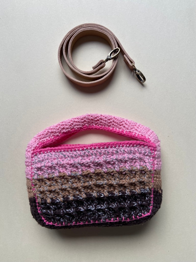Technical crochet Boxy bag by Anabaum shown with its detachable high-end leather shoulder strap on a clean background.