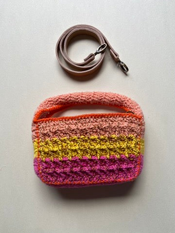 Technical crochet Boxy bag by Anabaum shown with its detachable high-end leather shoulder strap on a clean background.