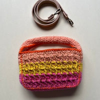 Technical crochet Boxy bag by Anabaum shown with its detachable high-end leather shoulder strap on a clean background.