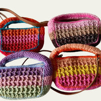 Four Anabaum Boxy bags in multi-tonal yarn showcasing premium textile textures and seasonal trend colors.