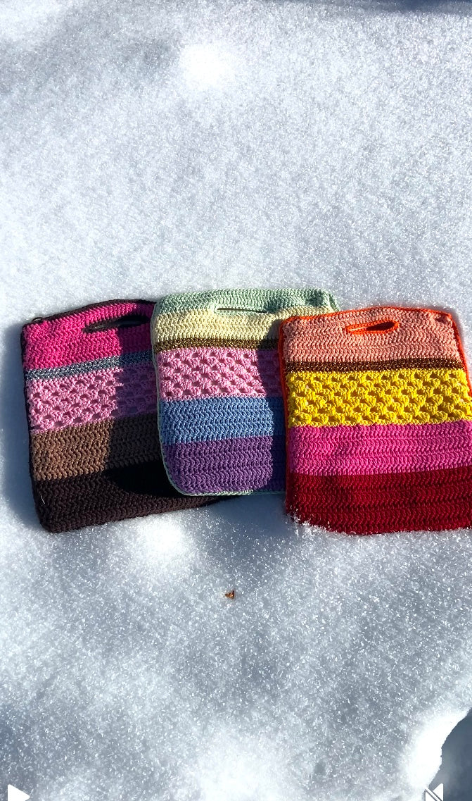3 anabaum shopper bags , color stripes with different textures, sized to hold a laptop , photographed in the snow