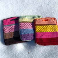 3 anabaum shopper bags , color stripes with different textures, sized to hold a laptop , photographed in the snow