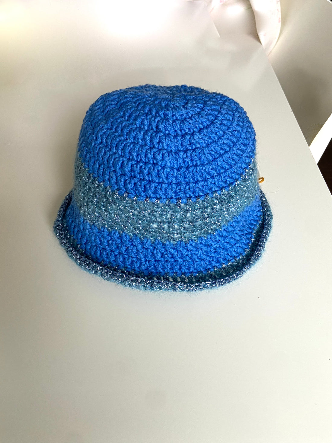 anabaum hat wooly made of merino wool in shades of blue with some matching metallic yarn for added bedazzle!